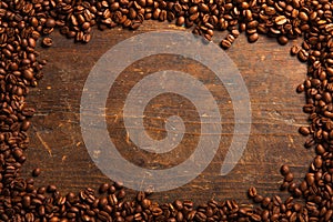 Coffee beans frame on wooden table