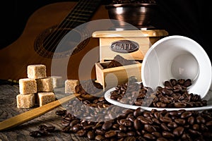 coffee beans with grinder and coffee cup