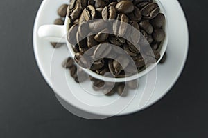 Coffee beans ground coffee and cup of black coffee