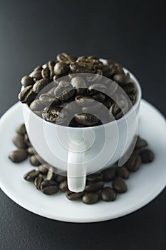 Coffee beans ground coffee and cup of black coffee