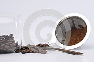Coffee Beans And Ground Coffee on white background