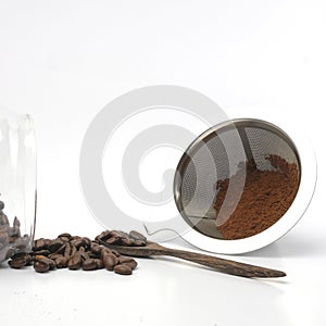 Coffee Beans And Ground Coffee on white background