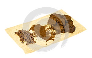 Coffee beans, ground and pressed espresso residues. photo