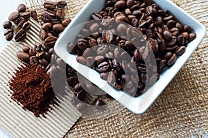 COFFEE BEANS AND GROUNDS ON A TABLE ARRANGEMENT