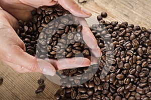 Coffee beans in hands