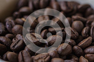 Coffee beans on a heap in a cup. Selective Focus.