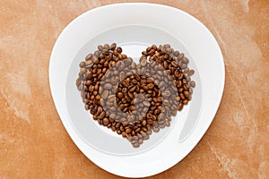 Coffee beans heart shape white plate