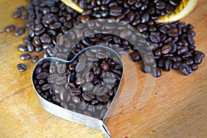 Coffee Beans heart shape on wooden table