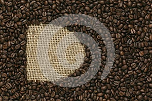 Coffee beans on Jute background