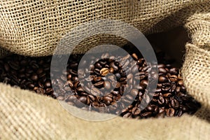 Coffee beans in a jute bag - food and beverages