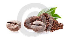 Coffee beans with leaf in closeup on white