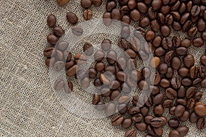 Coffee beans on linen top view