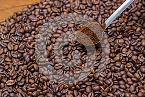 Coffee beans and metal spoon