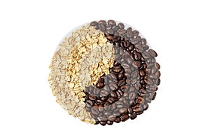 Coffee beans and oatmeal forming a yin yang symbol on a white background, isolate. Breakfast concept with coffee and