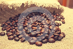 Coffee beans on burlap background