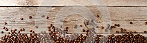 Coffee beans on an old wooden table