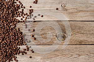 Coffee beans on an old wooden table