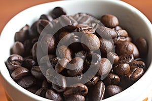 Coffee beans placed in a cup