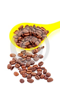 coffee beans in a plstic spoon