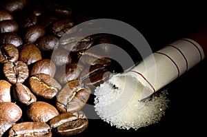 Coffee beans and poured sugar