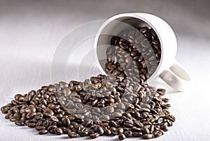 Coffee Beans Pouring Out of Cup