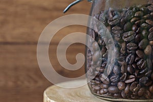 Coffee beans preserved in a glass bottle.