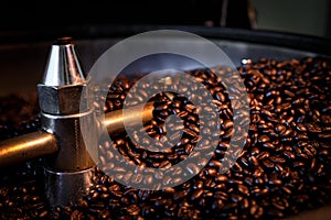 Coffee beans process roasted spin machine close up and selective focus