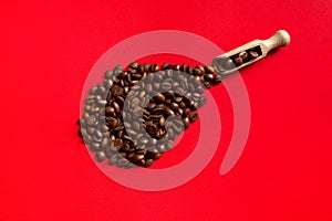 Coffee beans on a red background close-up