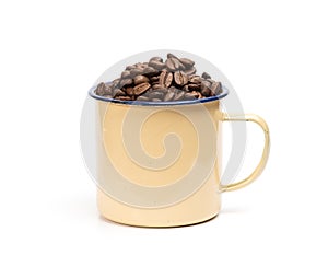 Coffee beans in a retro enameled mug isolated