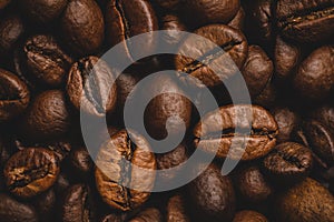 Coffee beans roasted full frame background Close up macro dark brown