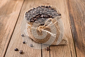 Coffee beans roasted in jute sack photo