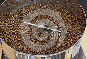 Coffee beans during the roasting process inside the hopper drum