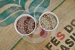 Coffee beans before and after roasting. Top view of brown and green grains