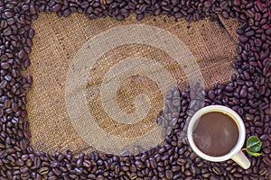 Coffee beans on sack background