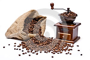 Coffee beans sack with coffee grinder still life