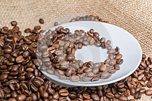 Coffee beans on the saucer.