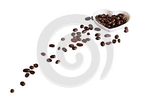 Coffee beans in saucer on white background