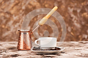 Coffee beans saucer, white coffee cup and cezve