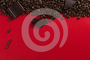 Coffee beans are scattered on a red paper background and chocolate, concept, commercial copy space