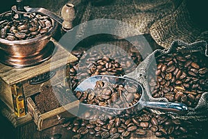 Coffee beans in scoop sack and mill