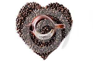 Coffee beans in the shape of a big heart with mug