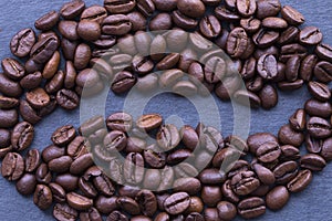Coffee beans sign or symbol on dark or graphite background