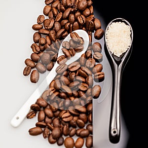 Coffee beans and small teaspoons