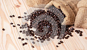 Coffee beans spilled out from linen sack