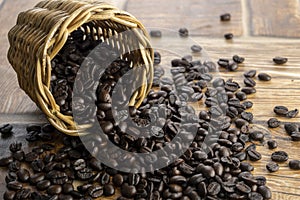 Coffee beans spilled out from a wicker basket