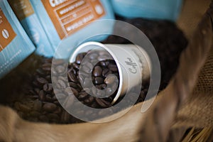 Coffee beans in straw basket with espresso cup