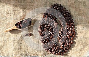 Coffee beans on a table being a large coffee bean