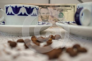 coffee beans on the table and dollar bill