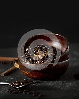 Coffee beans on table. Wooden desk. dark background