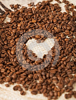 Coffee beans on the textile background